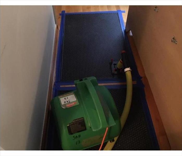 drying mats and airmover in hallway