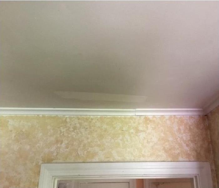 Smoke and soot damaged wall and ceiling