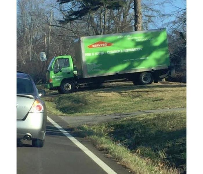 SERVPRO truck in the driveway of a house